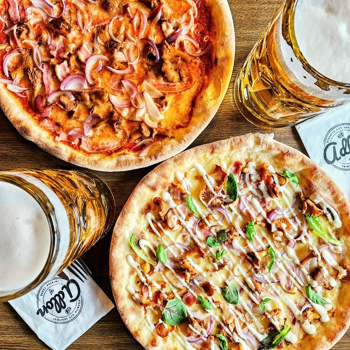 Two pizzas of your choice and two litres of beer