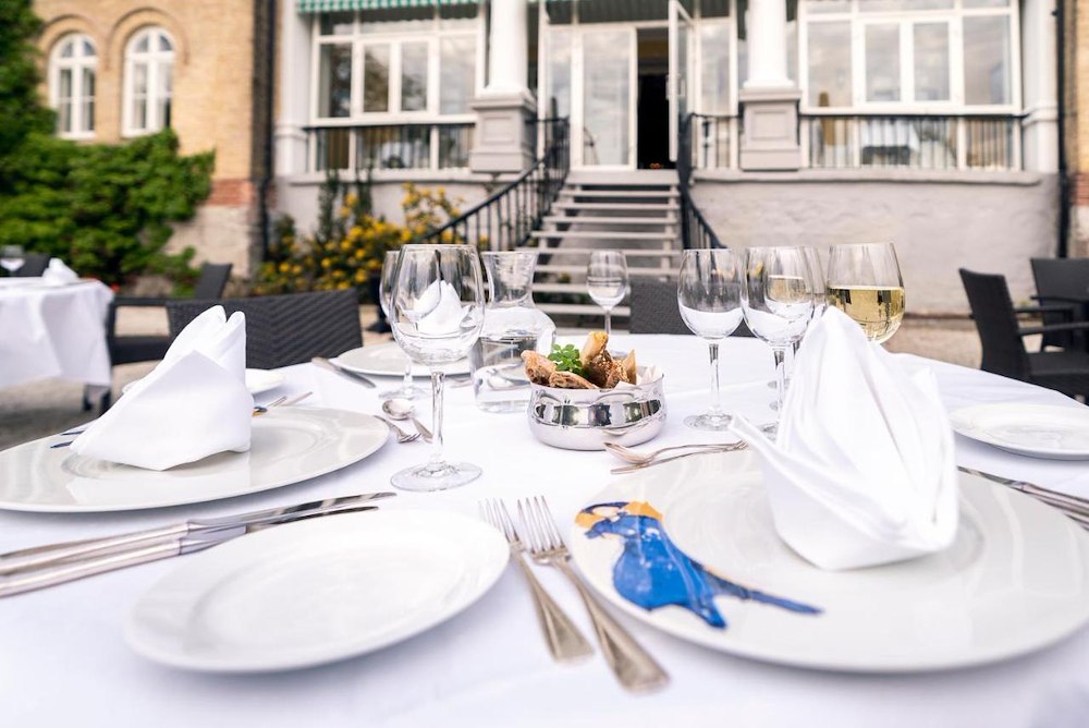 Image of Table at outdoor dining - add the number of people